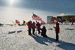 Foto session of the American tourists at ceremonial South Pole