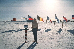Me, underdressed at the ceremonial South Pole