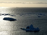 Sun on sea and icebergs