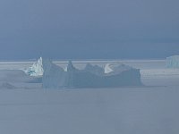 Icebergs spot lit by the sun