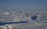 North Pole banner with PolarExplorer tents in background