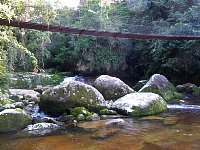 Bridge crossing waterfall