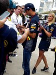 Daniel Ricciardo and PR assistant on autograph walk