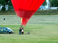 Passengers entering heart-shaped balloon