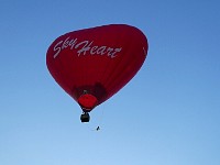 Heart-shaped balloon lifting off