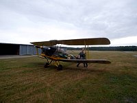 Tiger Moth next to hangar