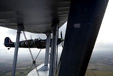 Spitfire with open cockpit close to Dragon Rapide