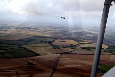 Spitfire heading over to Dragon Rapide