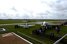 Dragon Rapide, Spitfire and Tiger Moths parked at Duxford
