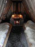 Hut interior with fire lit