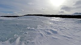 Lake with broken ice surface