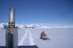 In the Tucker, with snowmobile at the side