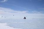 Snowmobile near blue ice runway