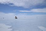 Snowmobile near blue ice runway