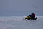 Snowmobile in Antarctica, guide, tourist