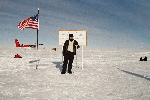 Me in leather jacket at the Geographic South Pole