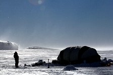 Twin Otter causing snow flurry in camp