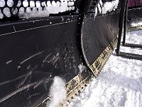 Snow mover, marked by ice