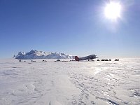 Tents in front of plane