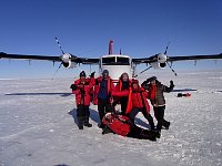Posing with Twin Otter in Antarctica
