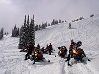 Watching snowmobilers