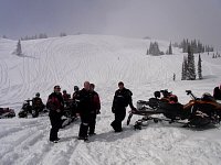 Watching snowmobilers