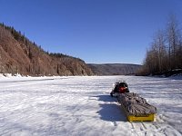 Snowmobile and skimmer on Yukon River