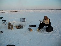 Me writing postcard at Shallow Bay