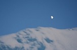 Moon over iceberg