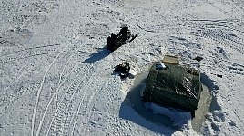 Snowmobile and tent