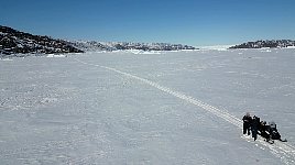 Drone near snowmobile
