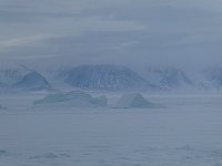 Fog rolling in over fjord