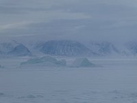 Fog rolling in over fjord