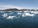 Boat among icebergs