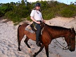 Me, riding along the beach