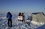 Eric taking a picture of Heinz and Lyndy at the North Pole