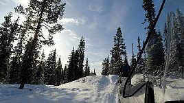 Snowmobile on steep ascent
