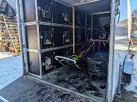 Dogs and sled in van