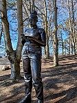 Sculpture of woman using smartphone by Thomas J Price