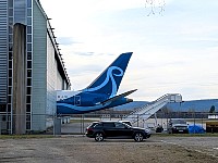 Plane tail sticking out of hangar
