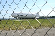 Zeppelin NT behind airport fence