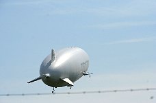 Zeppelin NT behind airport fence