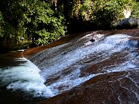 Sliding down waterfall