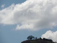 Zipline rider seen from below