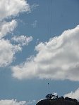 Zipline rider seen from below