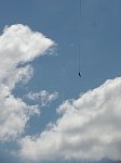 Zipline rider seen from below