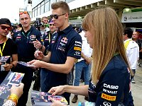 Daniil Kvyat and PR assistant on autograph walk