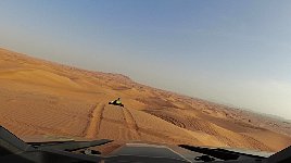 Following a quad in a dune buggy