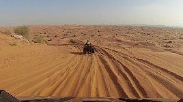 Following a quad in a dune buggy