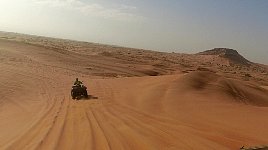 Following a quad in a dune buggy